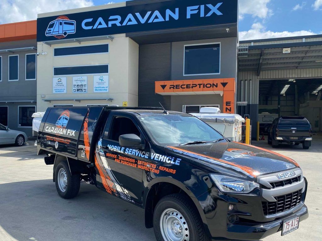 Caravan Fix team member inspecting interior of van Caravan Mobile Service