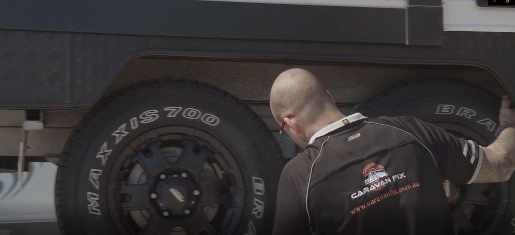 Caravan Fix team member inspecting van Caravan Fix team member inspecting van